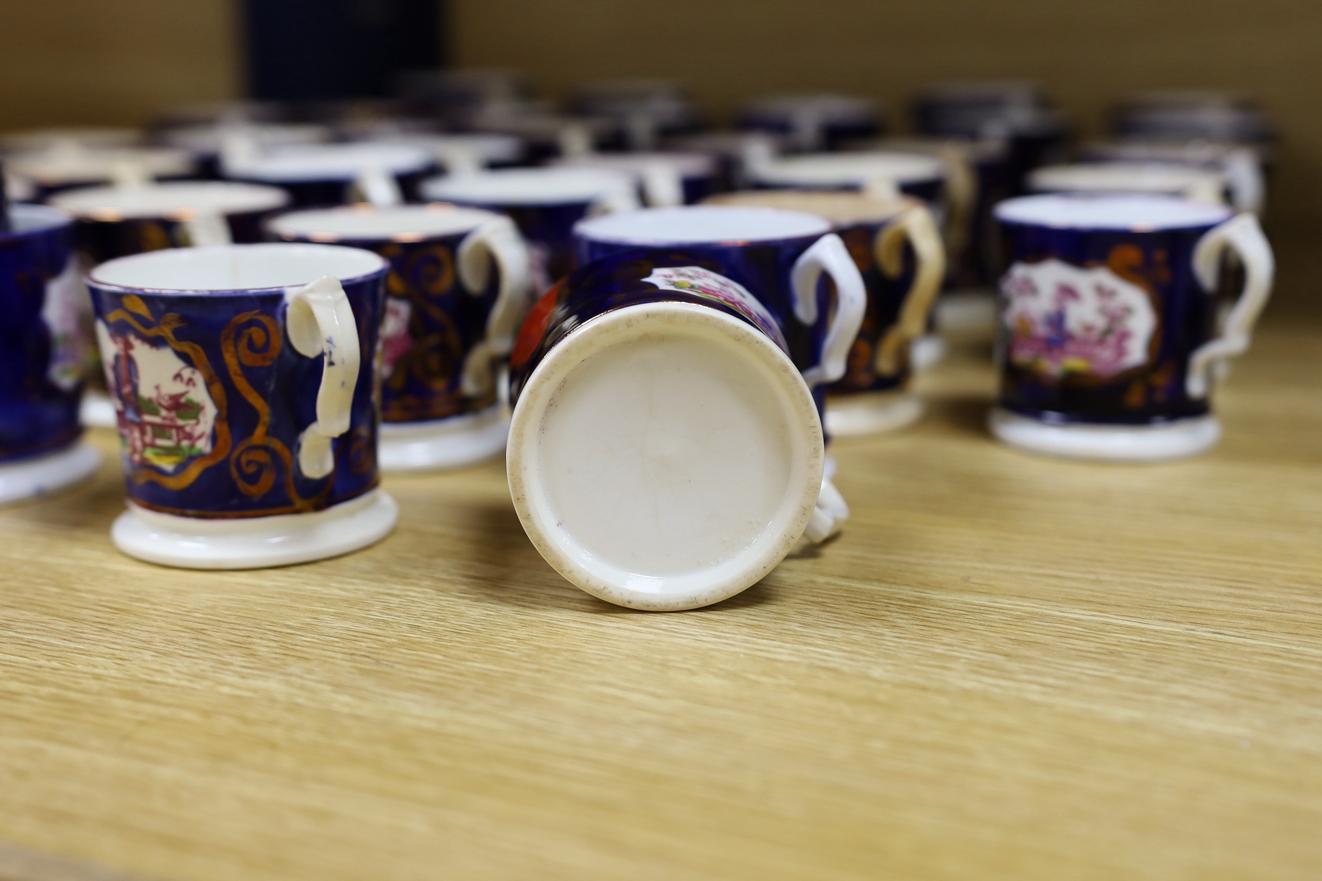 A quantity of Gaudy Welsh lustre cups with chinoiserie motifs, approx 40, varying in size